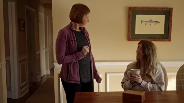 A tense conversation across a dining table
